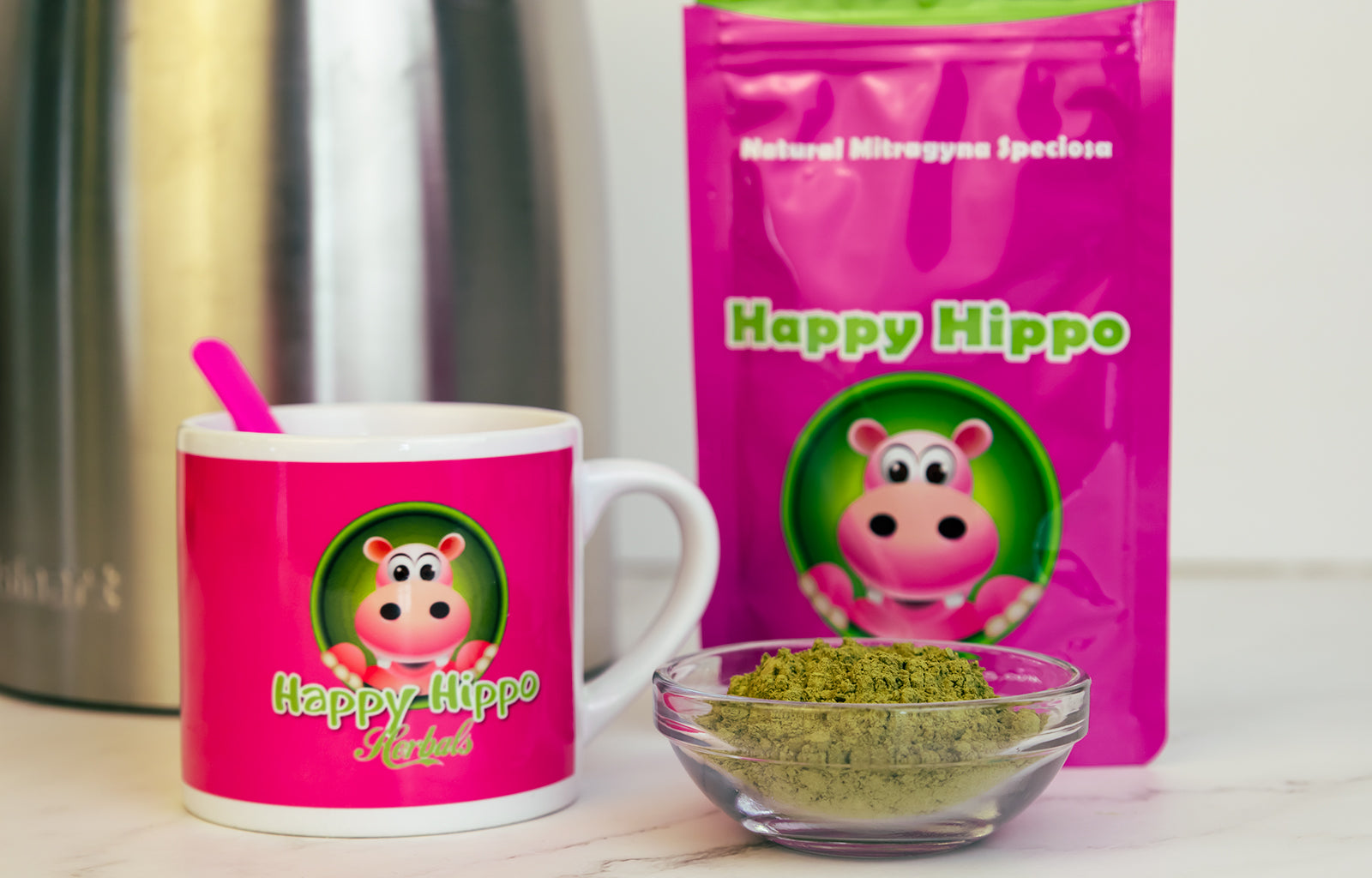 Featured Image depicting a coffee mug, and small ramekin filled with White Borneo Kratom Powder sitting in front of a Happy Hippo brand packet of Kratom Powder. Perfect for making kratom tea.