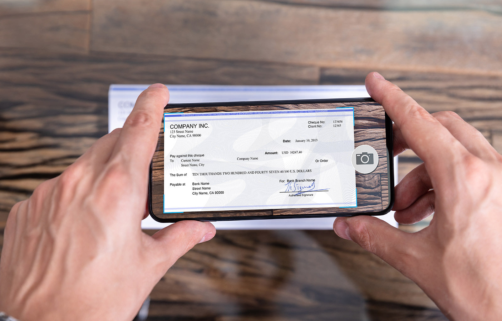 Featured image of a smart phone creating a mobile check for use as a payment