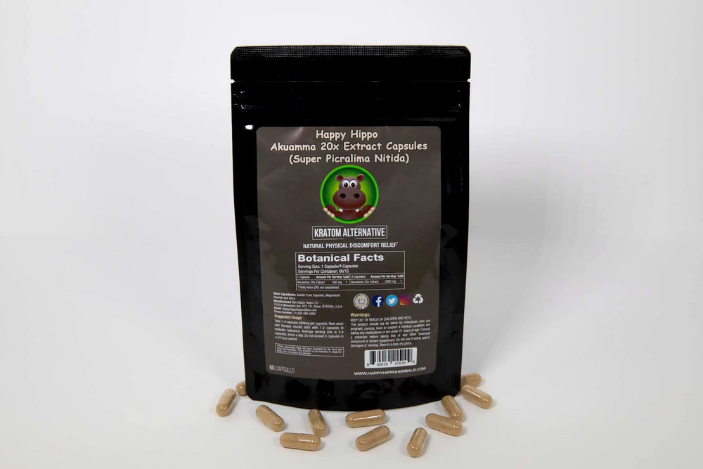 Product image depicting a packet of Happy Hippo Herbals brand Akuamma Seed Powder Capsules, with a few capsules scattered around the base of the packet