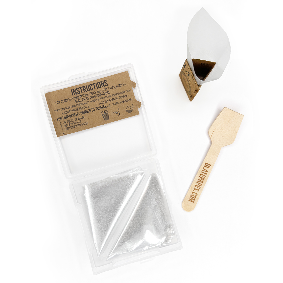 Photographic image depicting the inside instruction panel within a packet of Blate Papes, Edible Film Pouches. Includes a wooden measuring spoon.